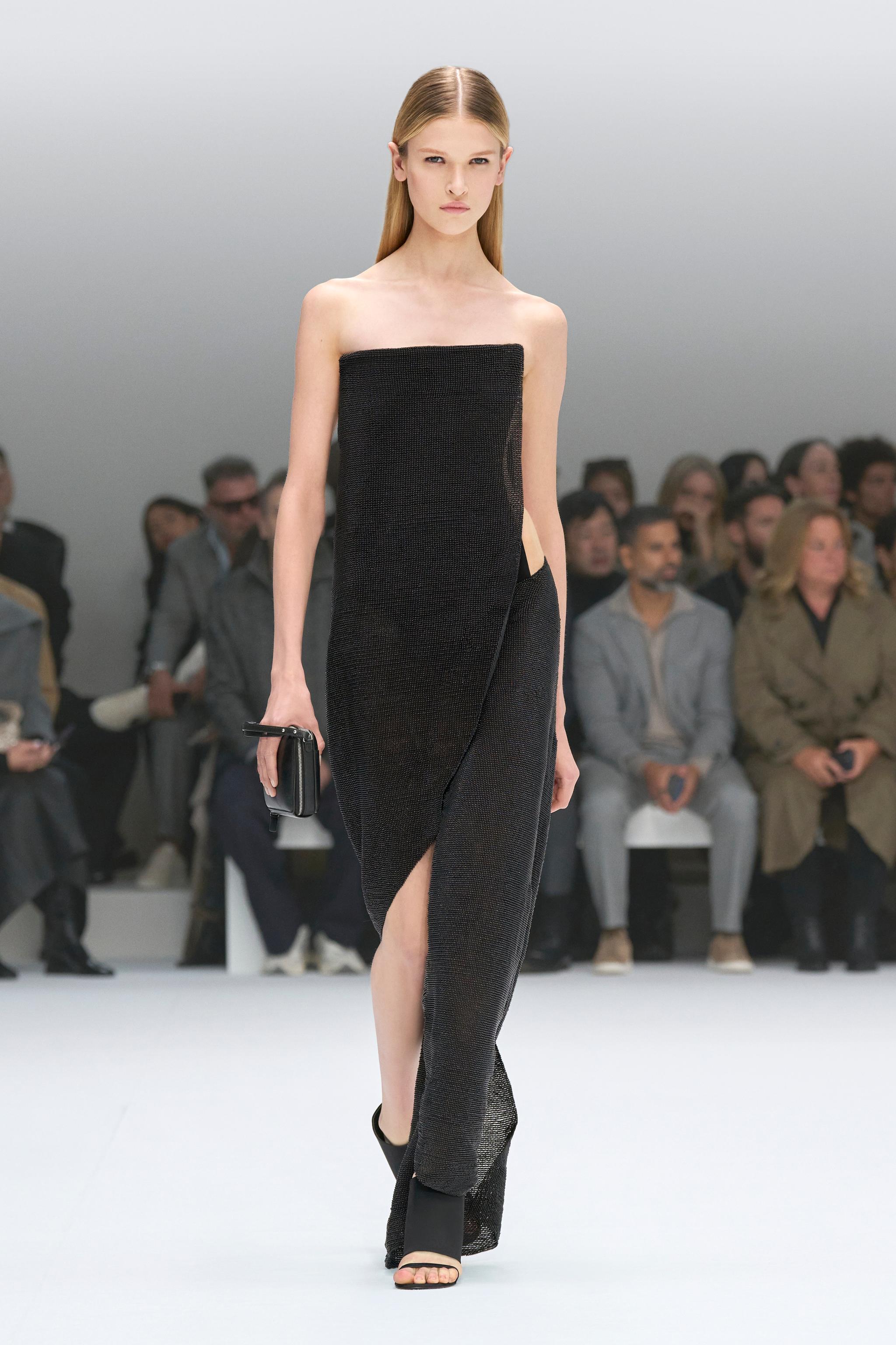 Elegant black Diane dress by Courrèges on runway, perfect for fashion-forward style.