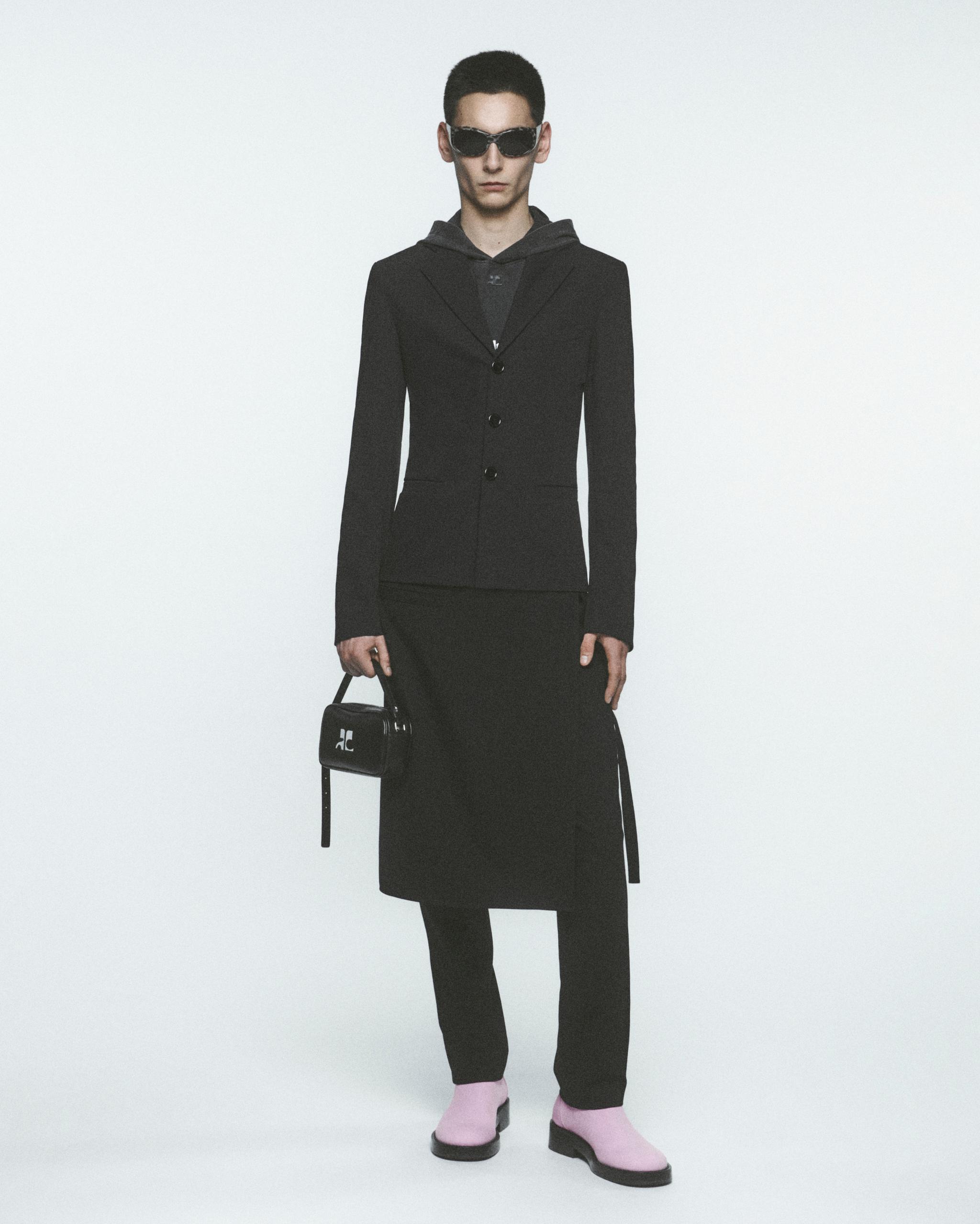 Elegant black women's fashion outfit showcasing Courrèges luxury design for ecommerce.