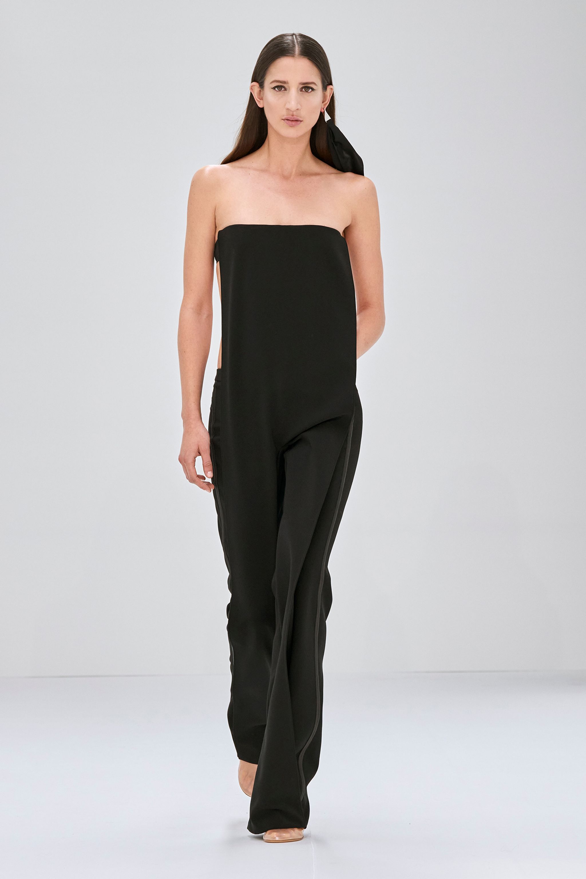 Elegant black strapless jumpsuit from Courrèges, perfect for modern fashion statements.