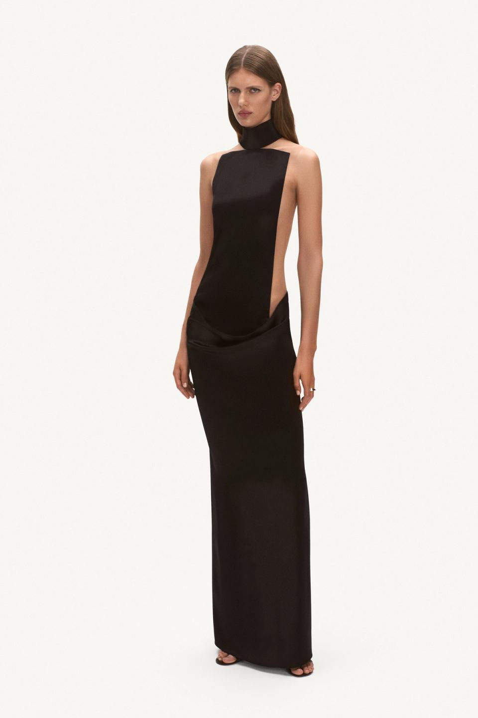 Elegant black cut-out evening gown by Courrèges, perfect for high fashion events.