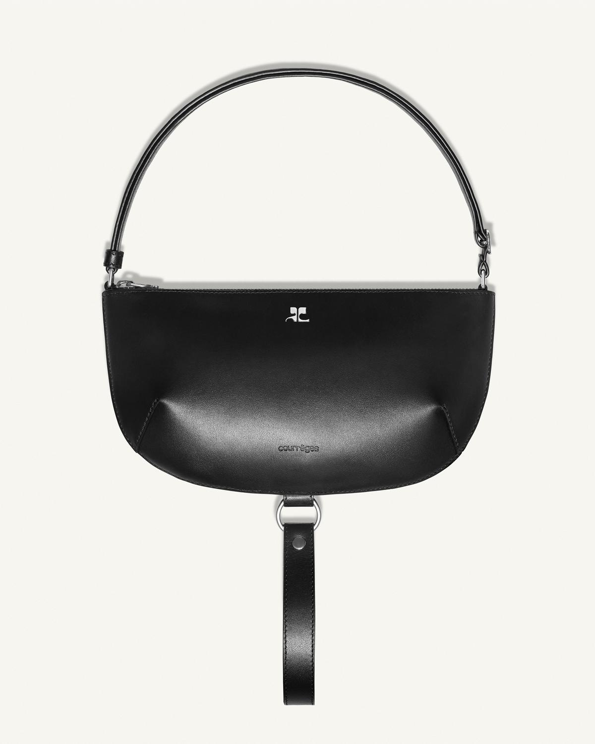 Elegant black leather handbag with silver accents, Courrèges aesthetic for fashion accessories.