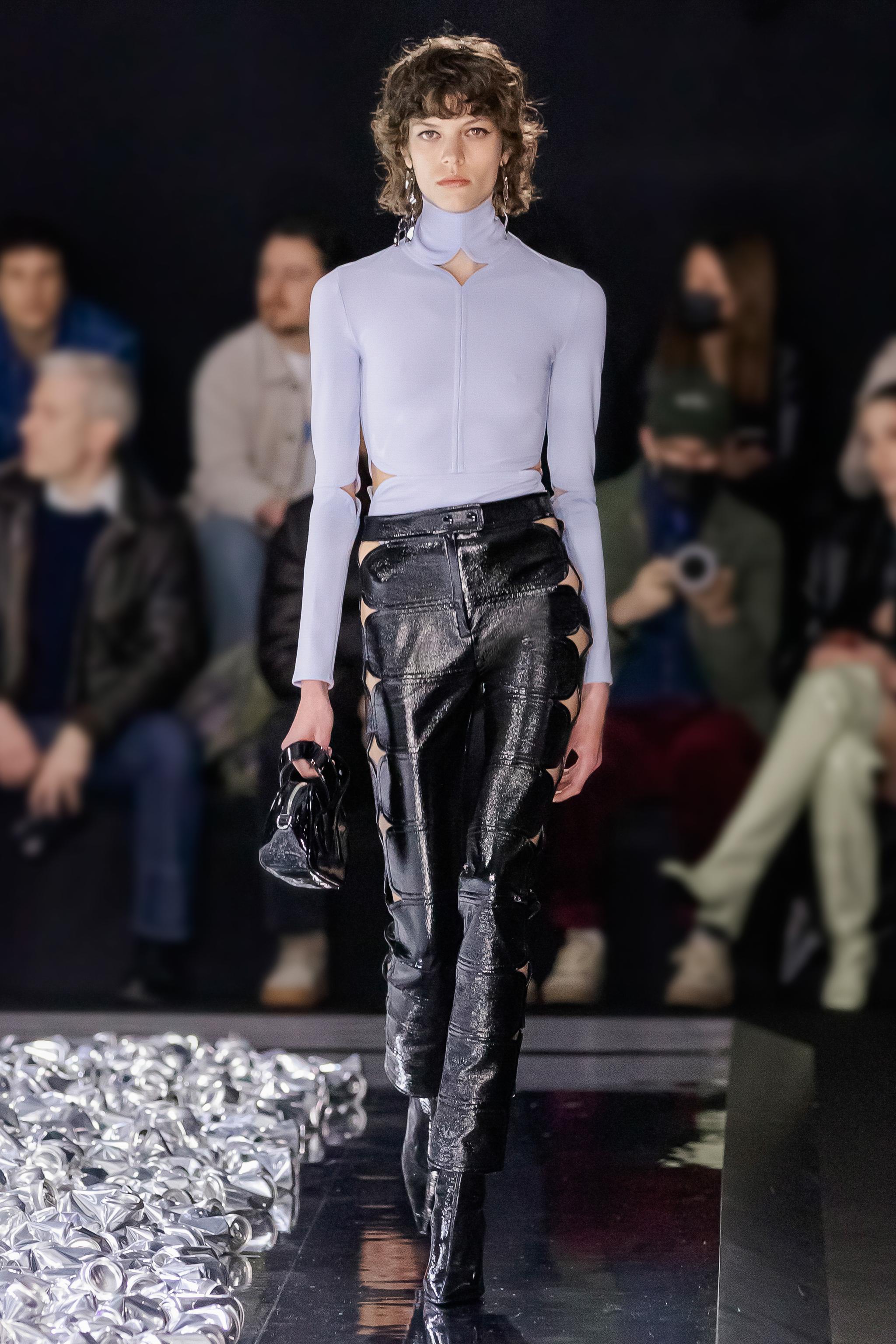 Elegant fashion runway showcasing Courrèges apparel with modern style and sophistication.