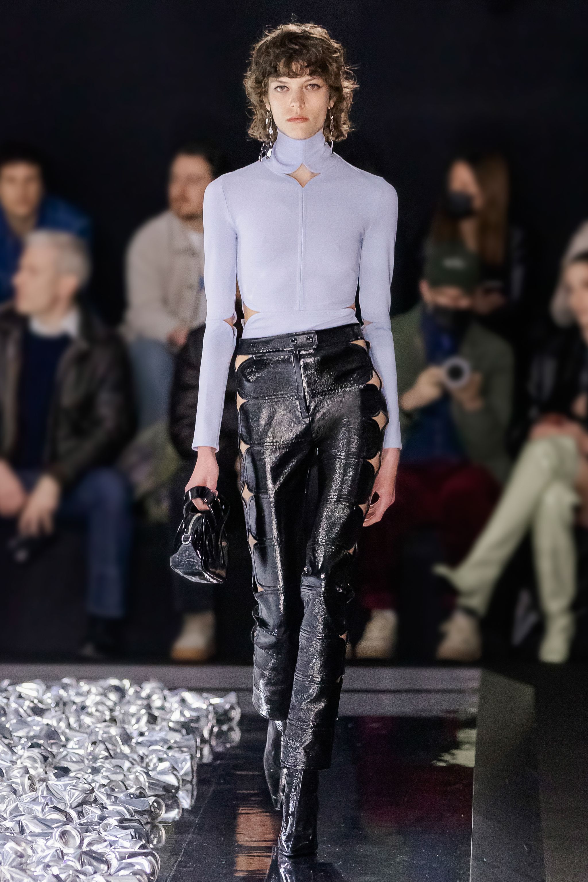 Elegant fashion runway showcasing Courrèges apparel with modern style and sophistication.