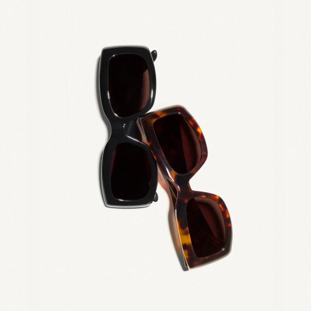 Elegant sunglasses with black and tortoiseshell frames, perfect for Courrèges fashion style.