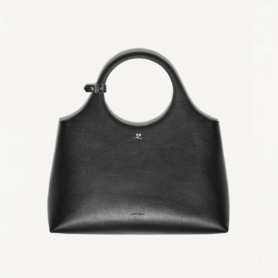 Sac à main noir en cuir Courrèges avec anse circulaire, idéal pour une mode moderne.