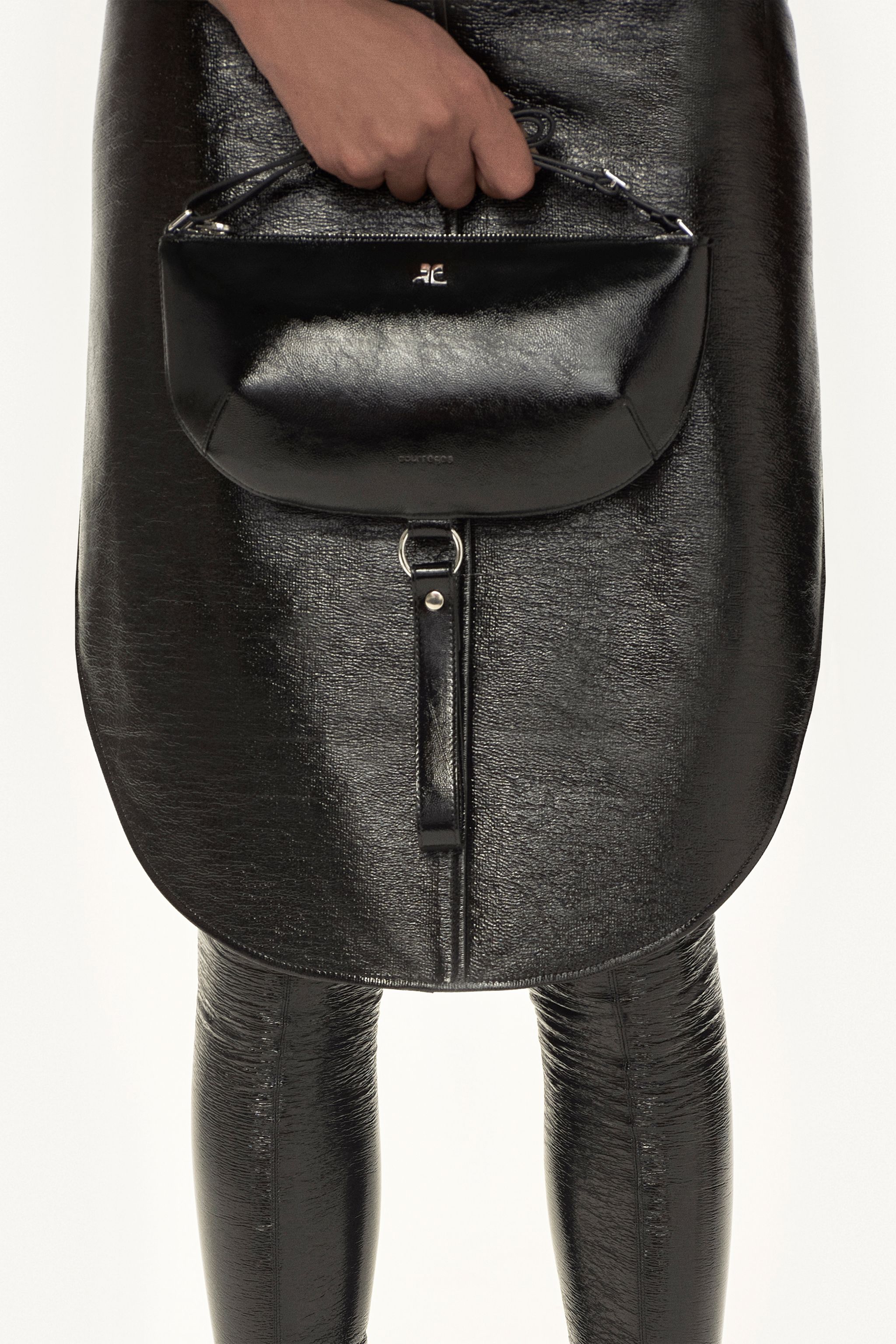Elegant black leather handbag with silver accents, part of Courrèges fashion accessories collection.