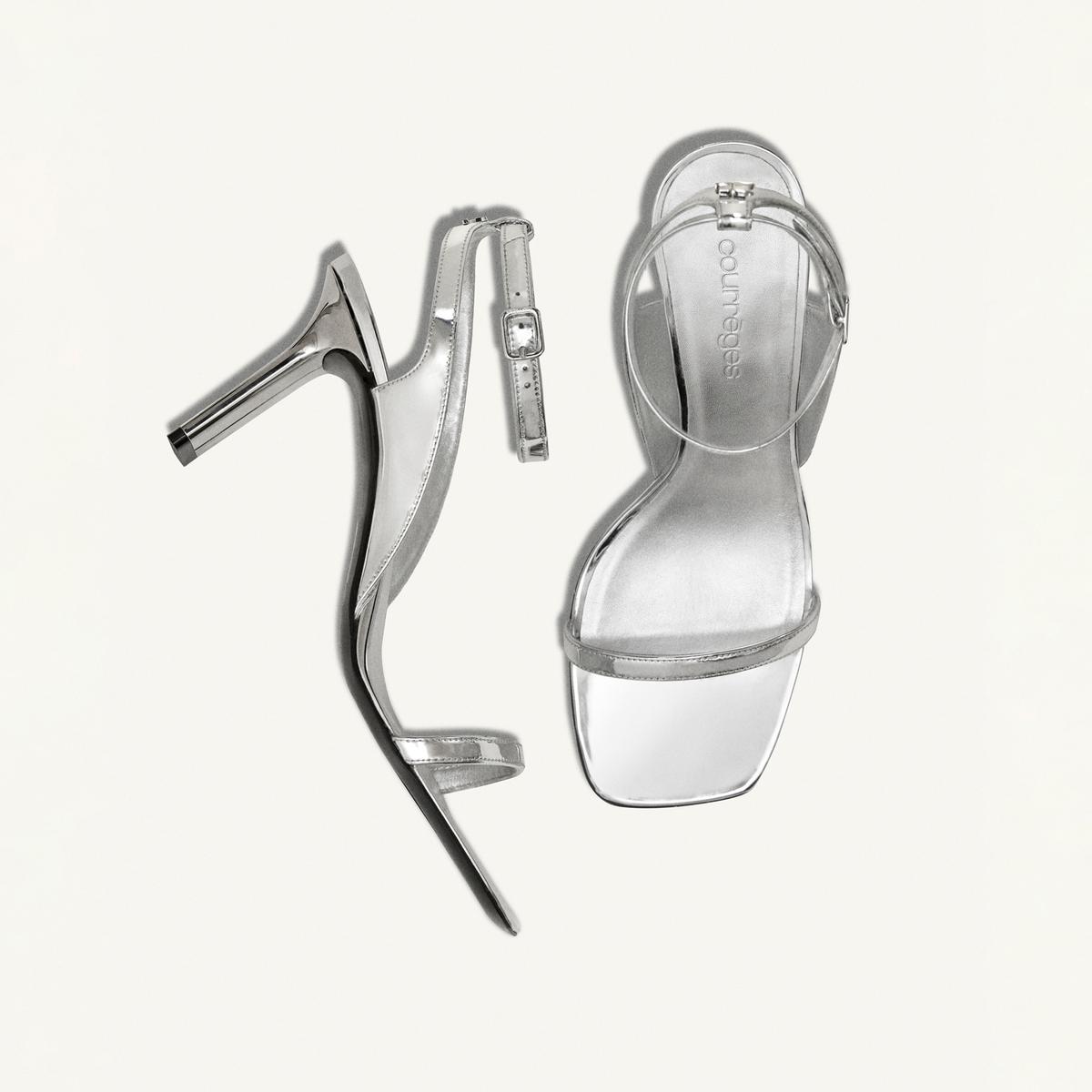 Elegant silver high-heeled sandals from Courrèges, perfect for a chic fashion statement.