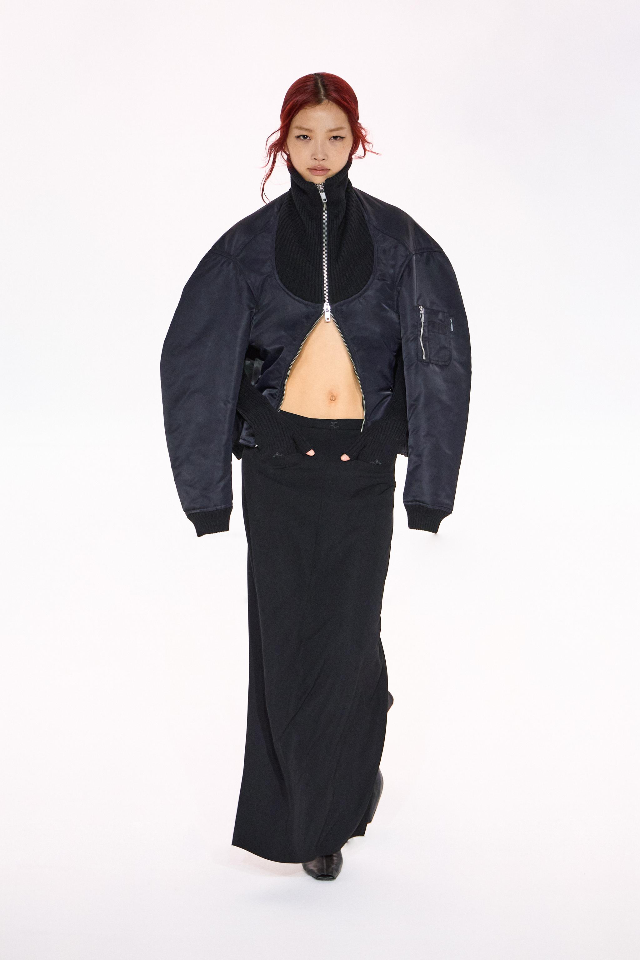 Elegant black bomber jacket and maxi skirt by Courrèges, showcasing modern fashion style.