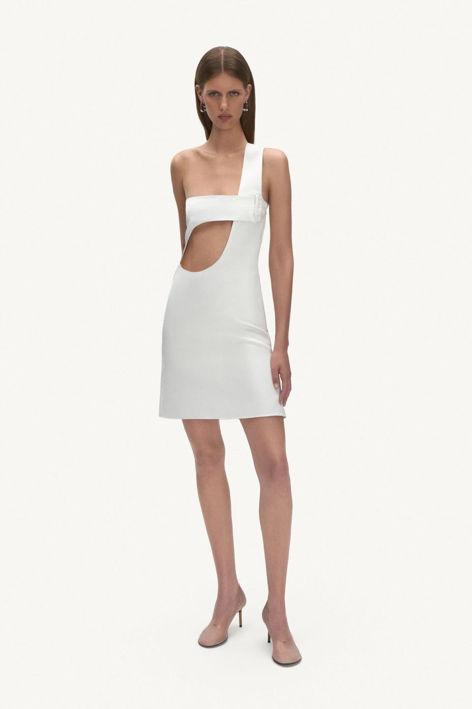 Elegant black crop top and pants from Courrèges, showcased on a fashion model for an ecommerce site.