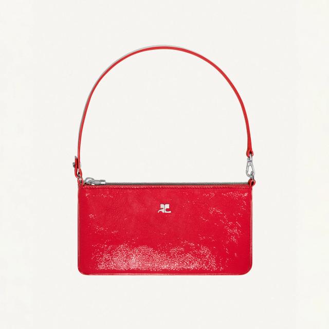Elegant red leather handbag with minimalistic silver logo, perfect for Courrèges fashion.