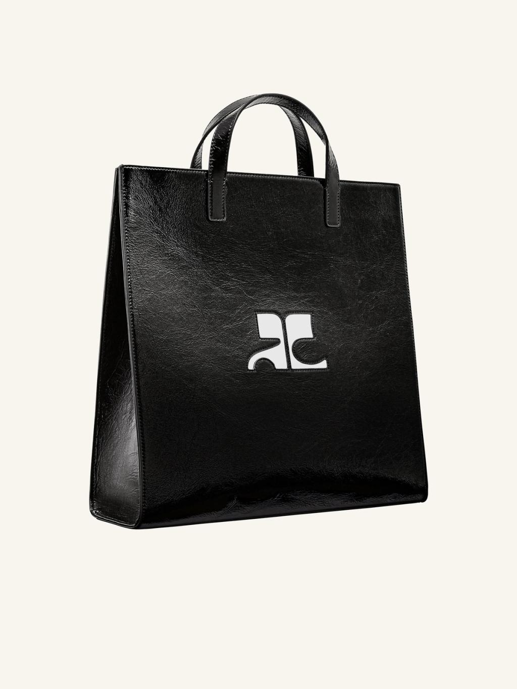 Elegant black leather tote bag with Courrèges logo, perfect for chic fashion accessories.