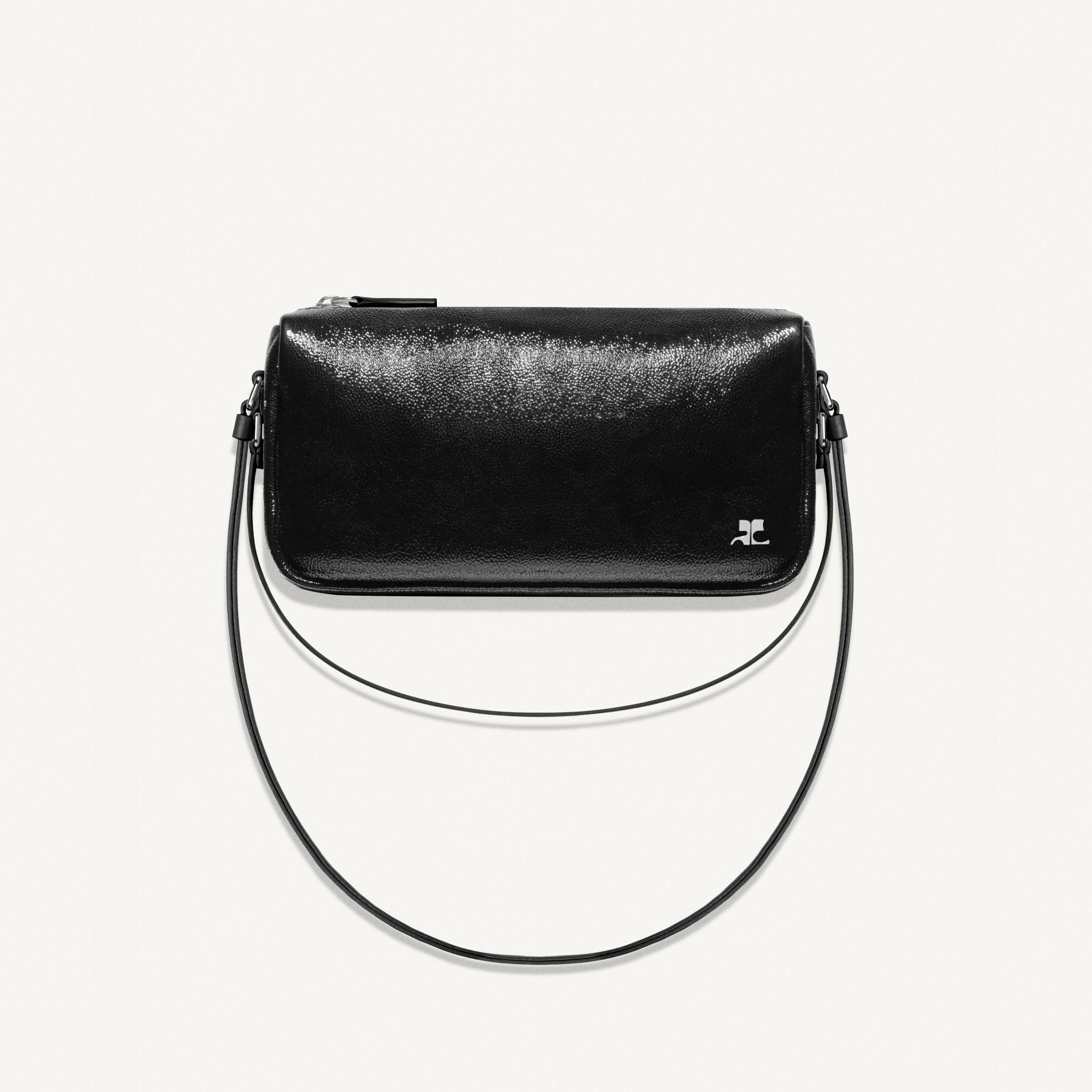 Elegant black leather handbag from Courrèges, perfect for modern fashion accessories.