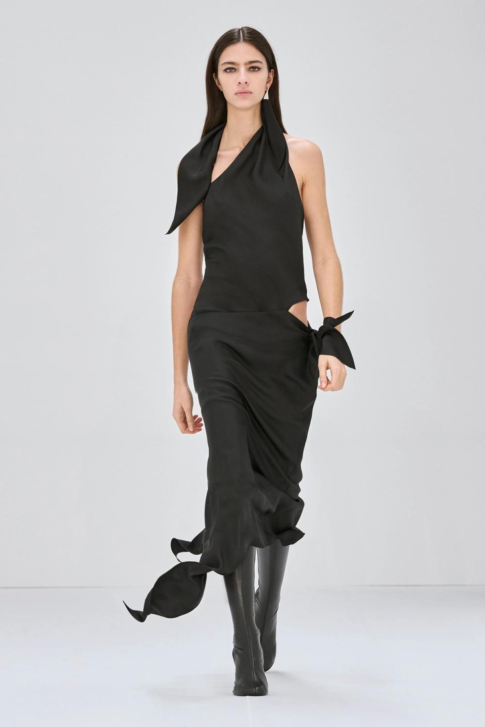 Elegant black dress with a statement neck tie, designed by Courrèges for chic fashion statement.