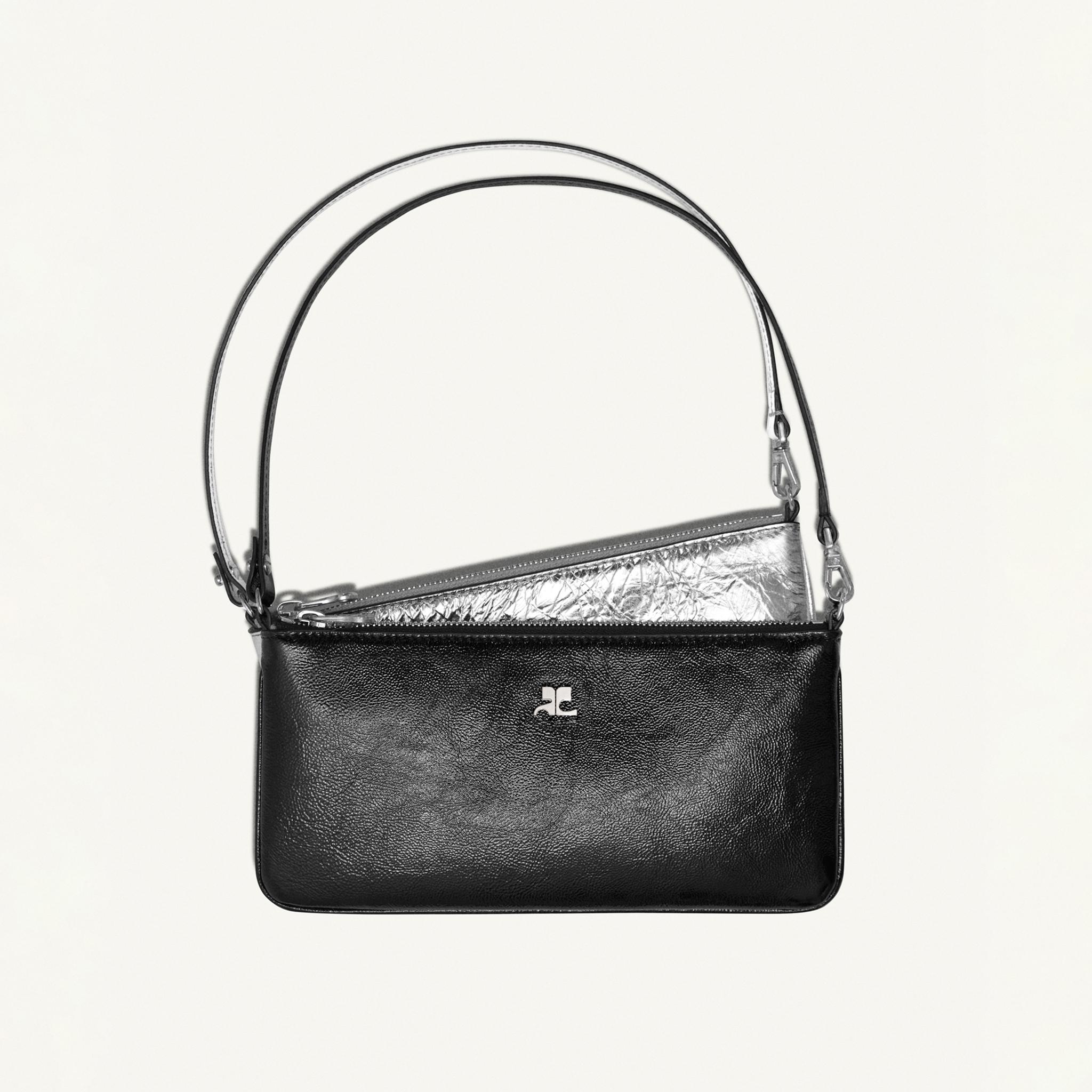 Elegant black leather handbag with metallic accents, versatile design, Courrèges fashion accessory.