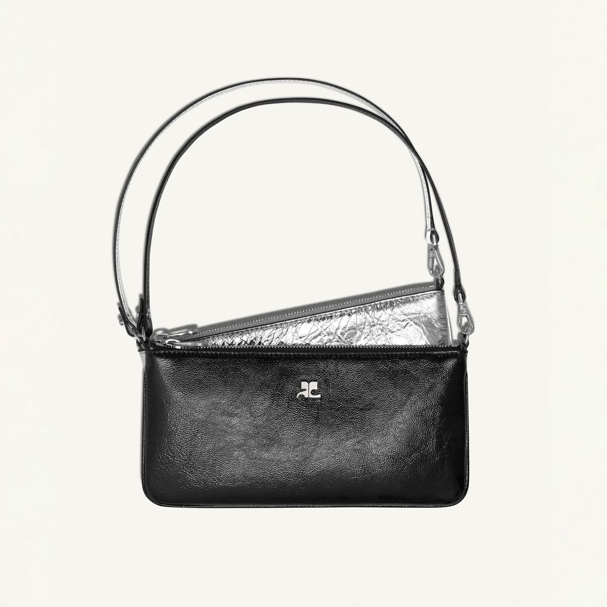 Elegant black leather handbag with sleek silver accents, from Courrèges fashion brand.