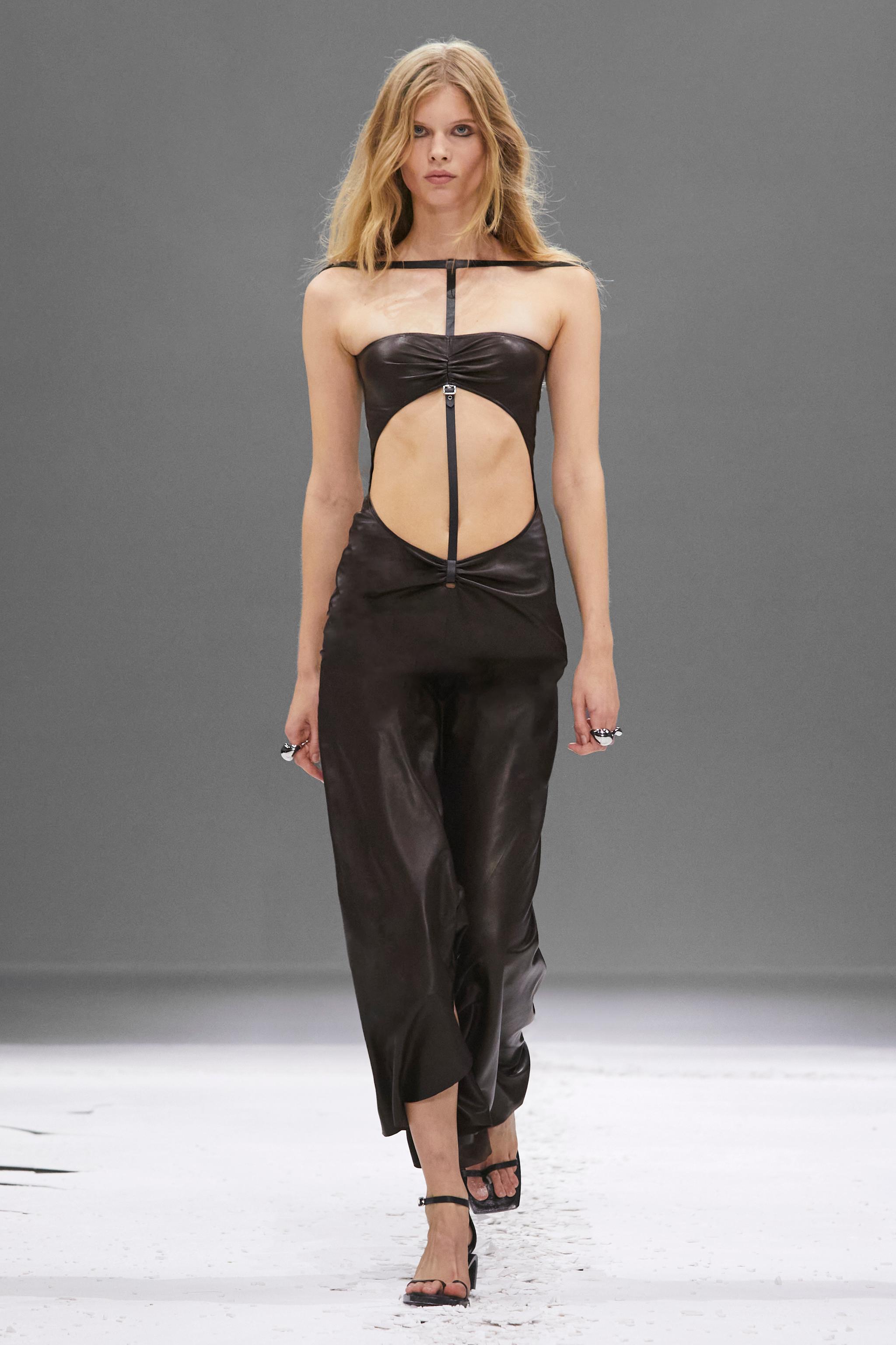 Elegant black leather cutout dress for Courrèges fashion, showcasing modern style and sophistication.