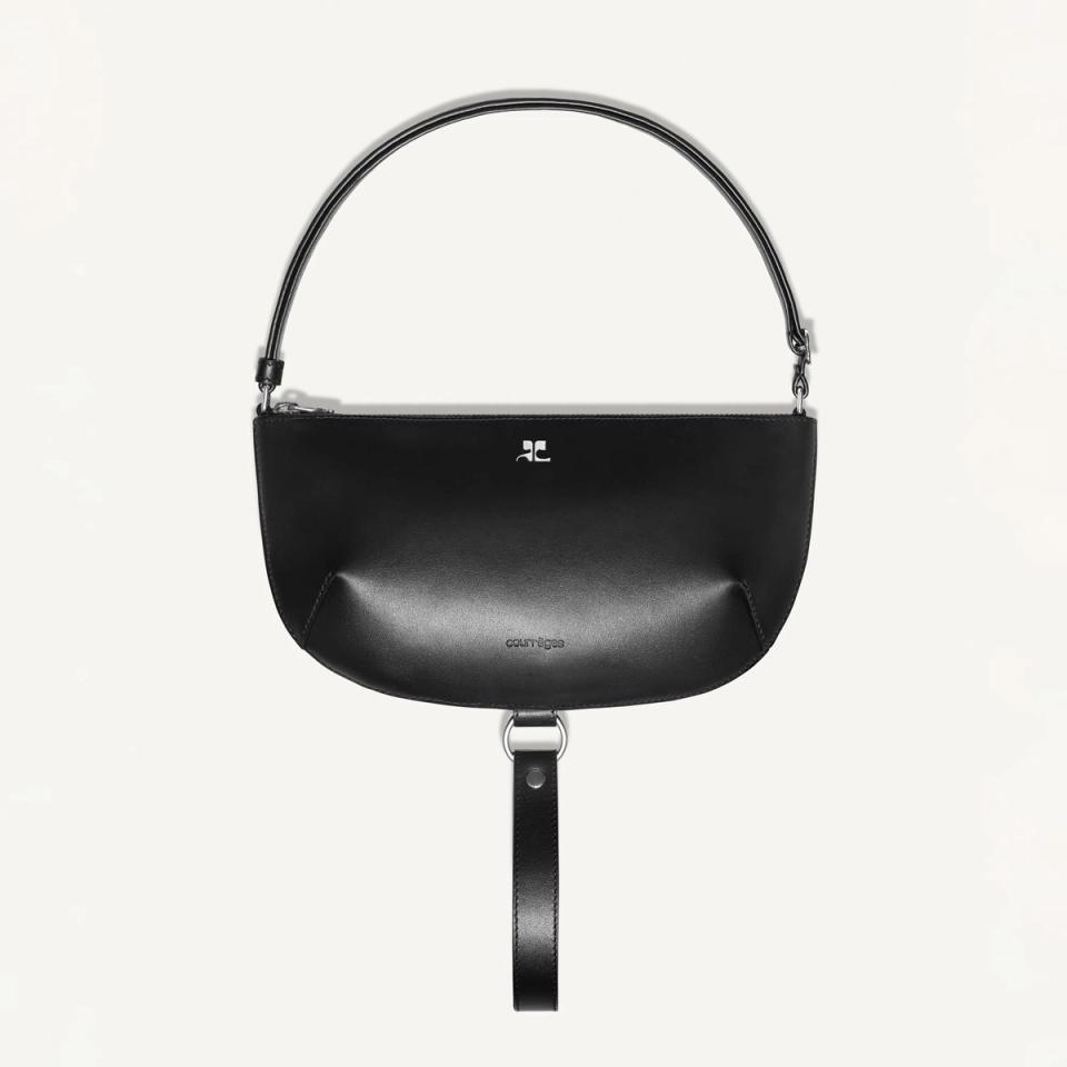 Elegant black leather handbag with minimalist design, Courrèges branding, and modern style.