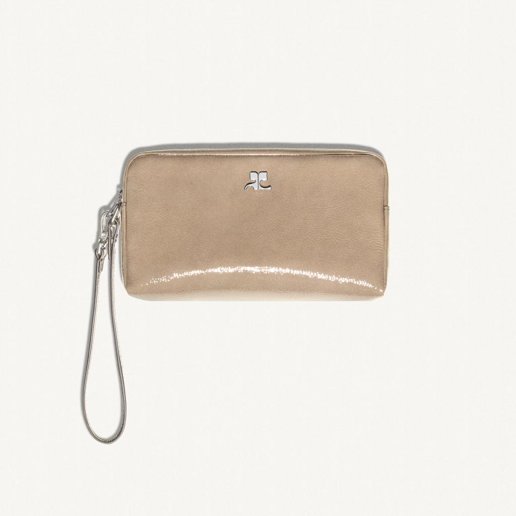 Elegant Courrèges wristlet with minimalist design, perfect for on-the-go fashion accessories.