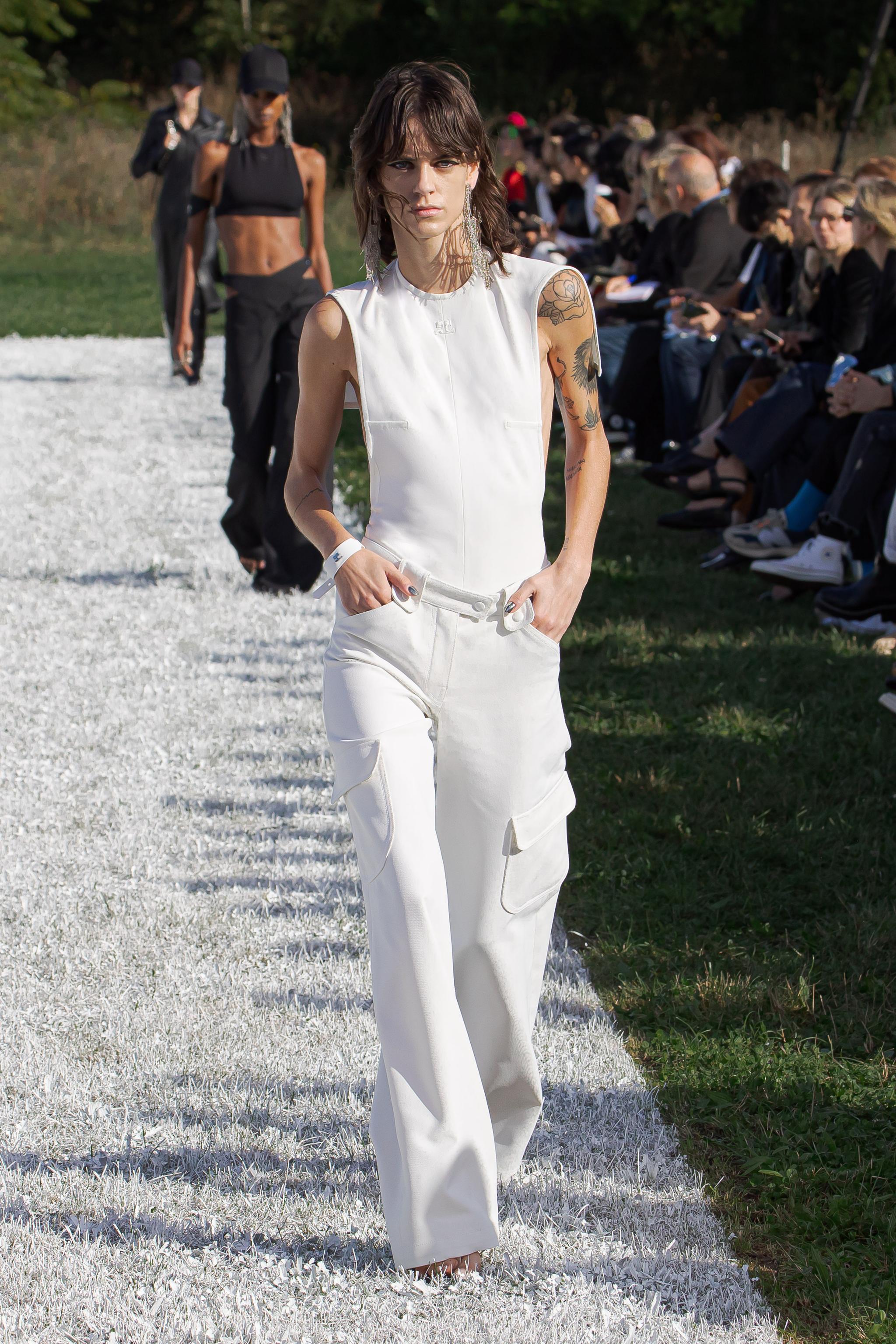 Elegant white fashion runway look featuring Courrèges apparel for a stylish online shopping experience.