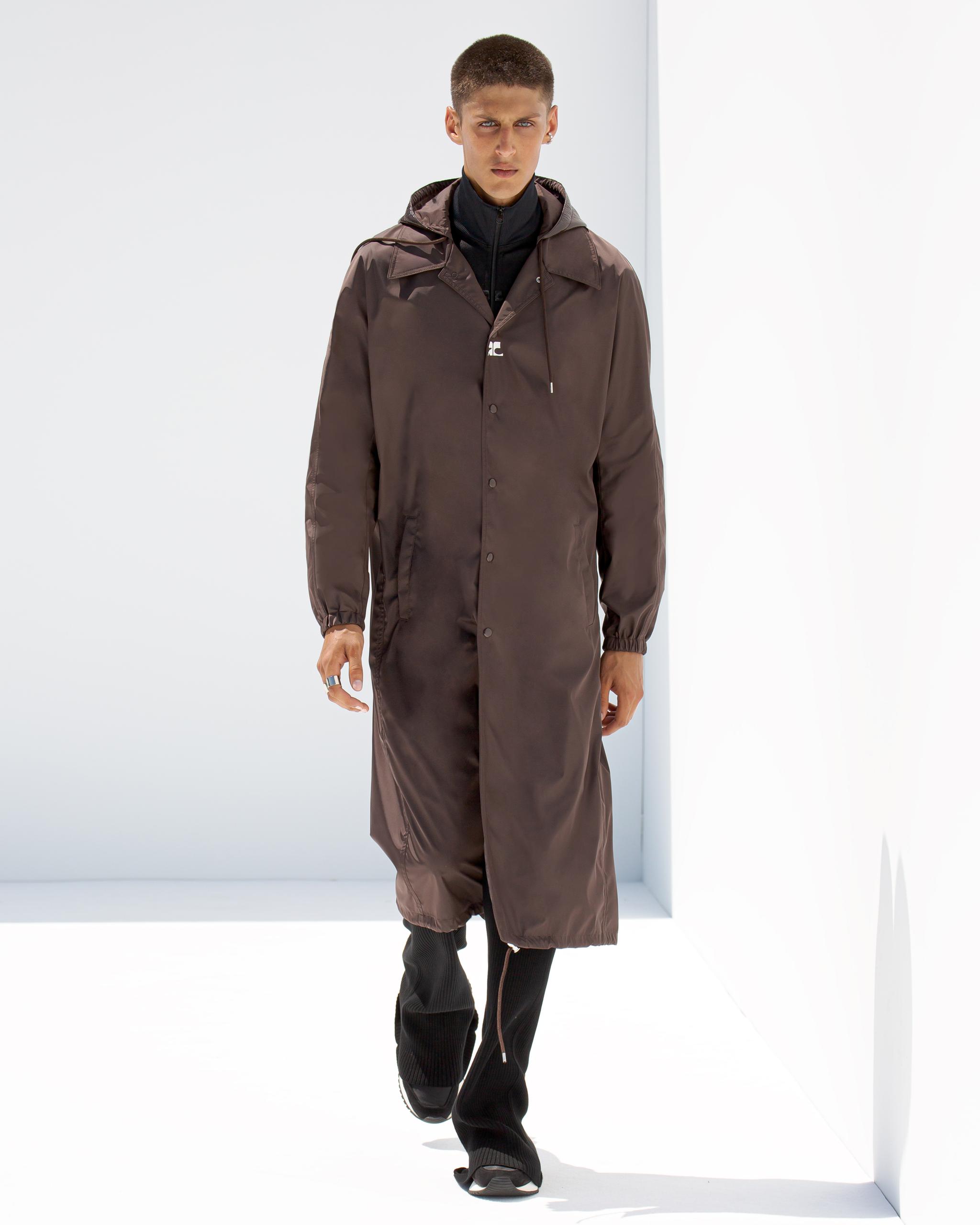 Elegant brown trench coat from Courrèges, perfect for modern fashion on an ecommerce site.