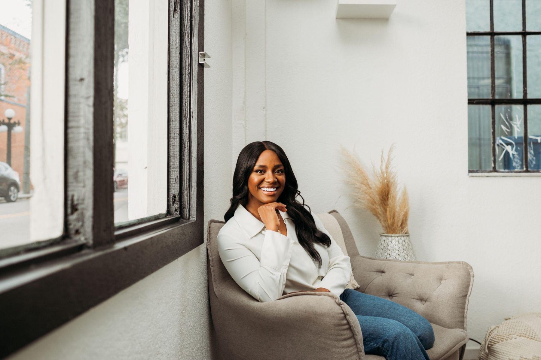 Danielle Bayard Jackson seated by a window