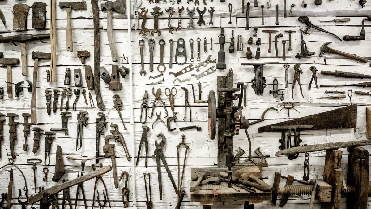 A wall with old-fashioned tools