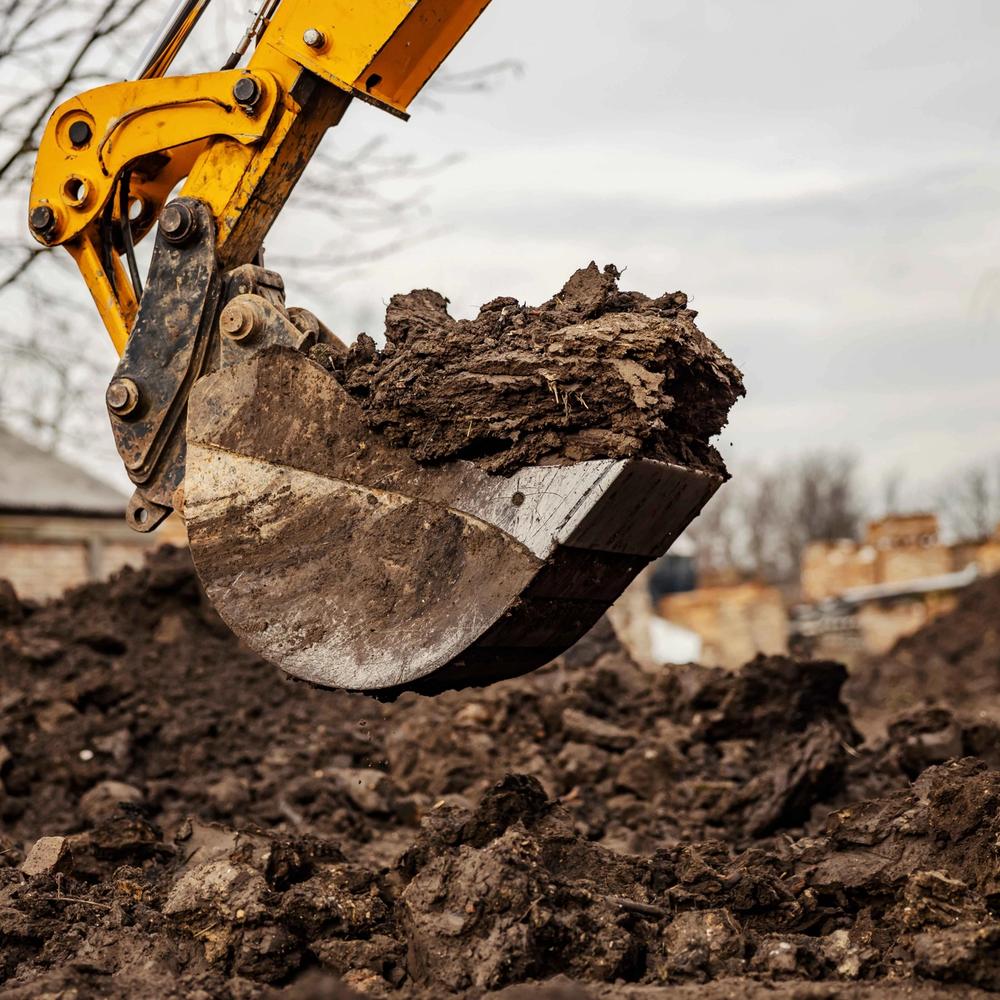 Gravemaskin i arbeid