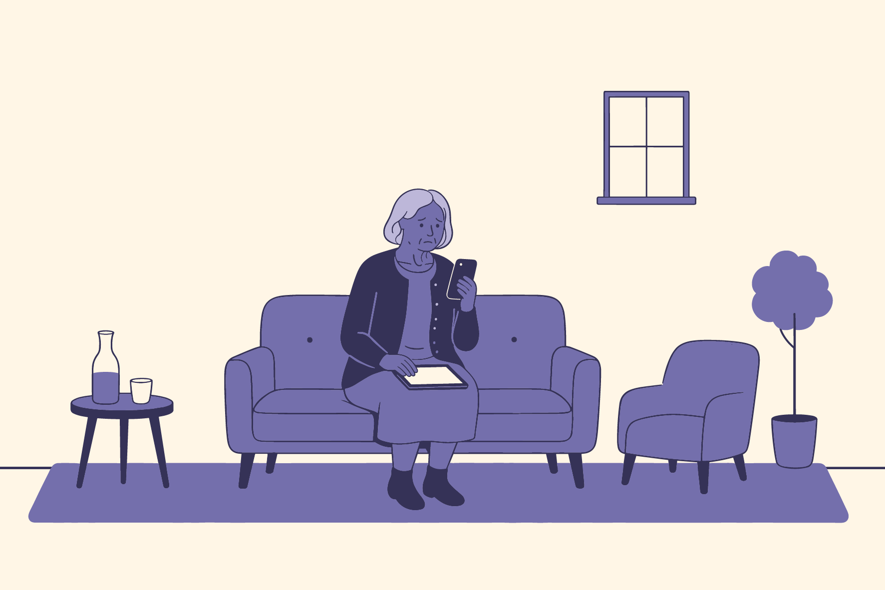 Dame sitter i sofa å ser på telefon - og nettbrett