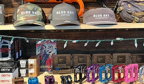 Close up of Blue Sky bikes logo baseball hates and a vaierty of bicycle accessorties.