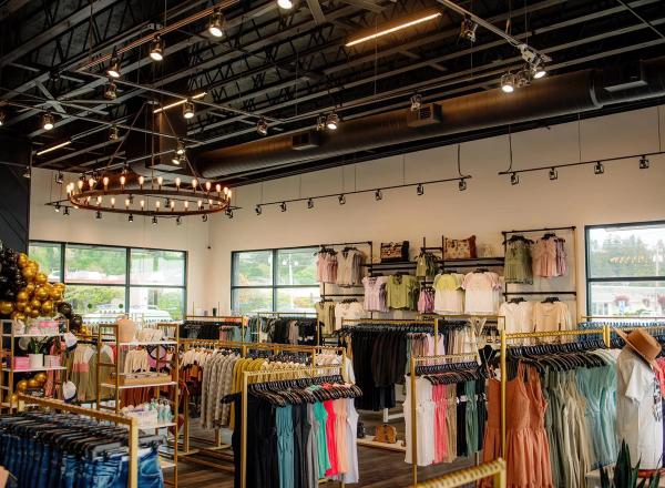 interior shot of store with clothing racks and high ceilings