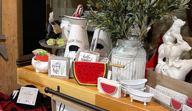 bright red, white and green watermelon home decor items displayed on a shelf