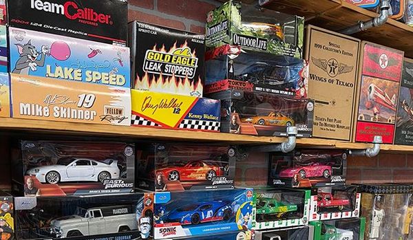 Close up images of games, large toy cars and sports action dolls. 