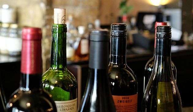 Wine bottles on a counter with a blurred background