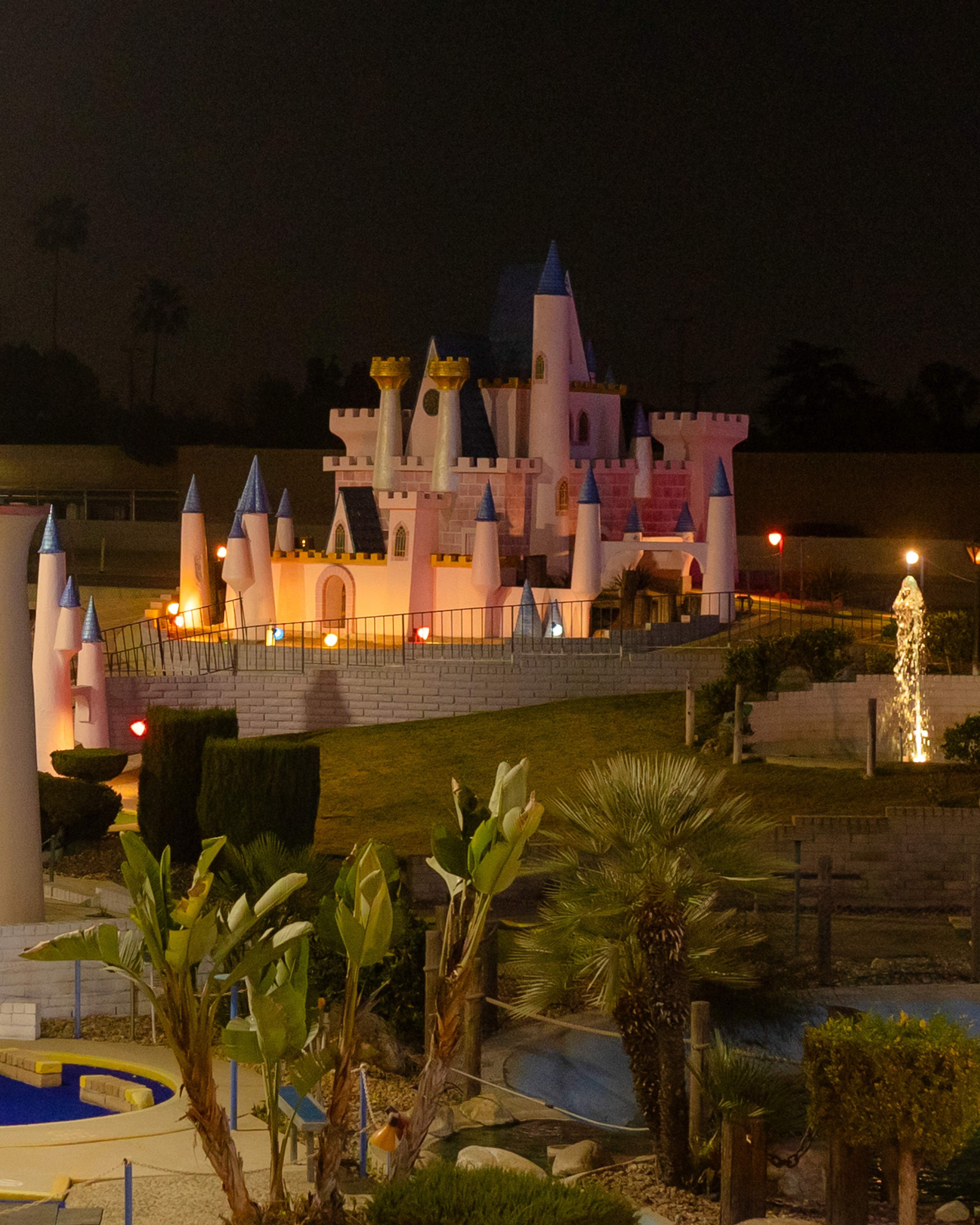 Illuminated castle and miniature golf course at Bullwinkle's Upland