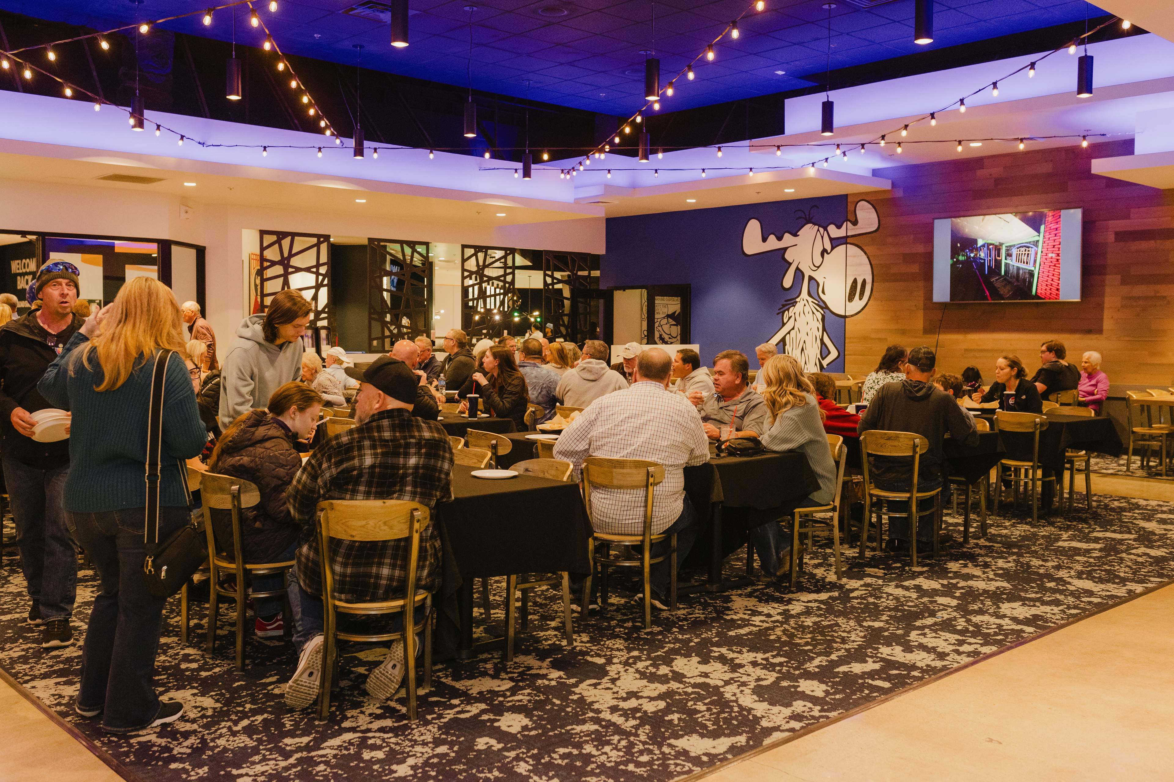 Guests catching up in the event space at Bullwinkle's Upland