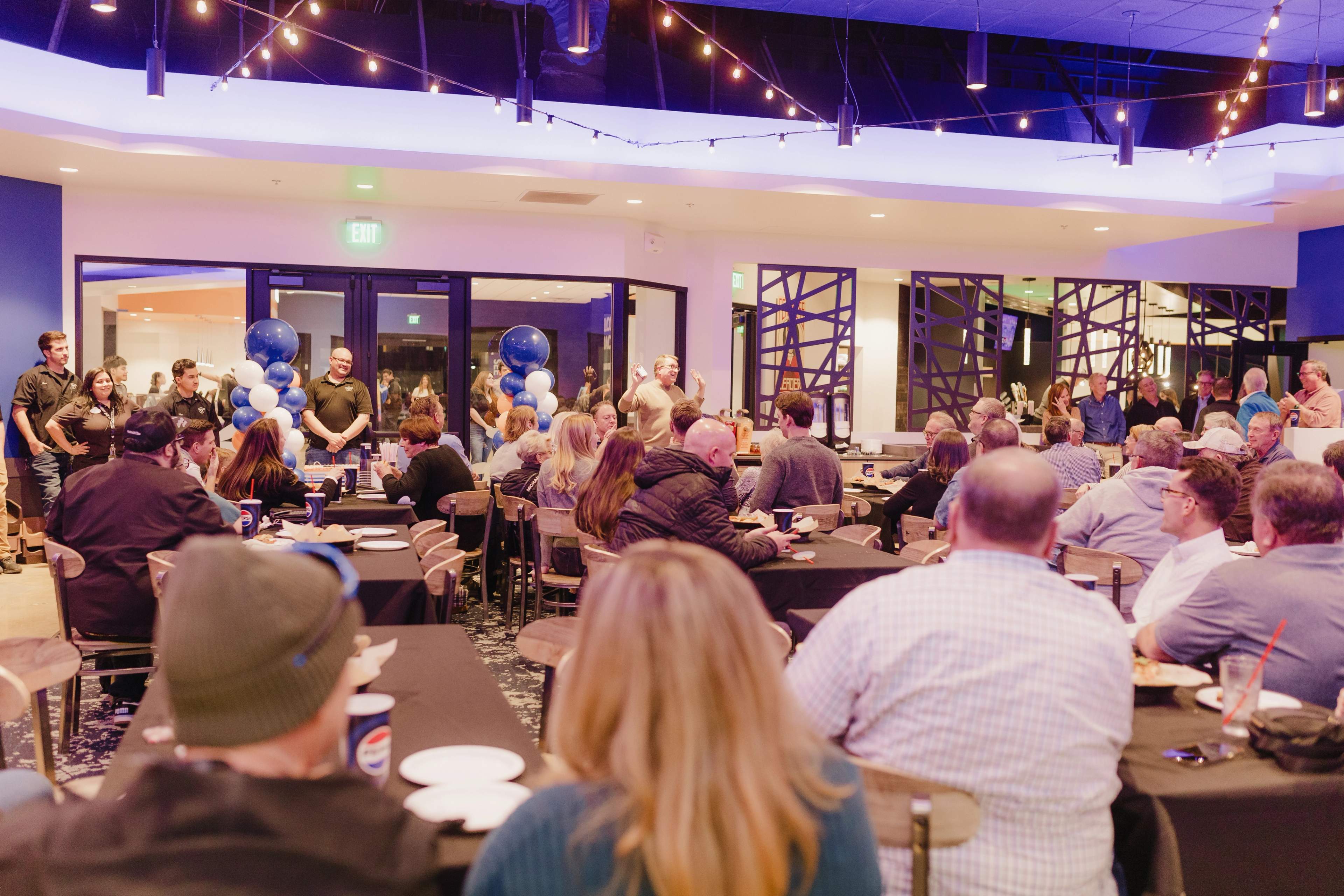 Guests gathered around tables for a celebration at Bullwinkle's Upland