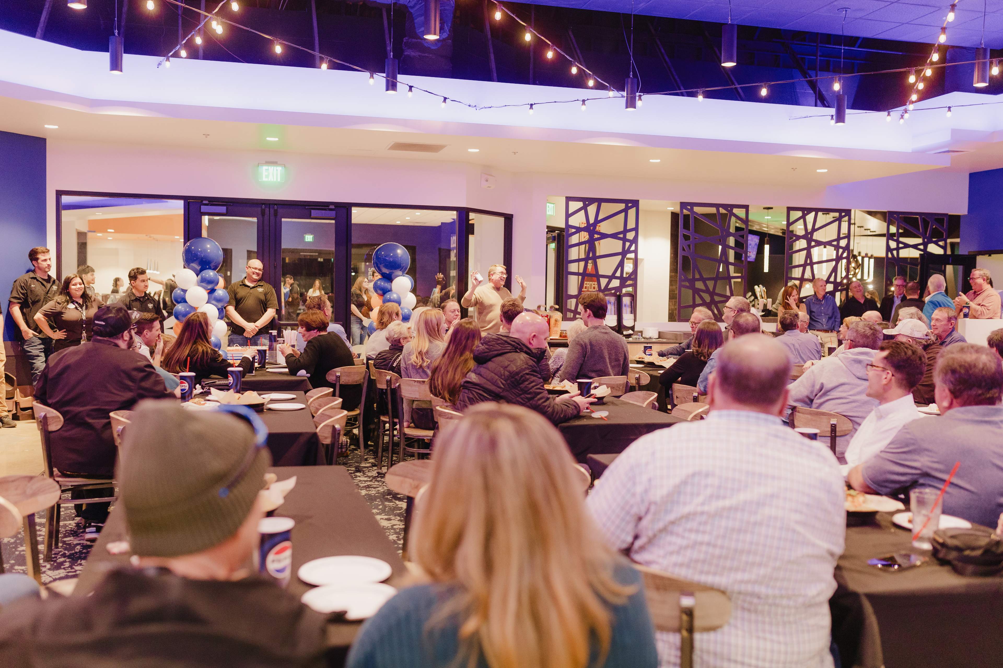 Guests gathered around tables for a celebration at Bullwinkle's Upland