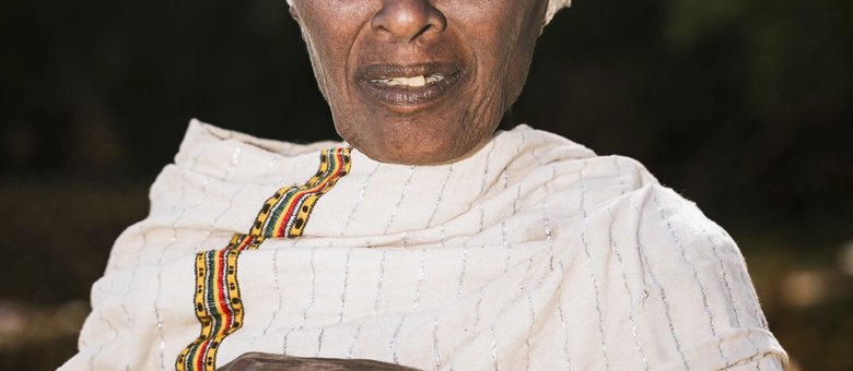Portrait of an elderly woman in traditional dress in Oromia, Ethiopia