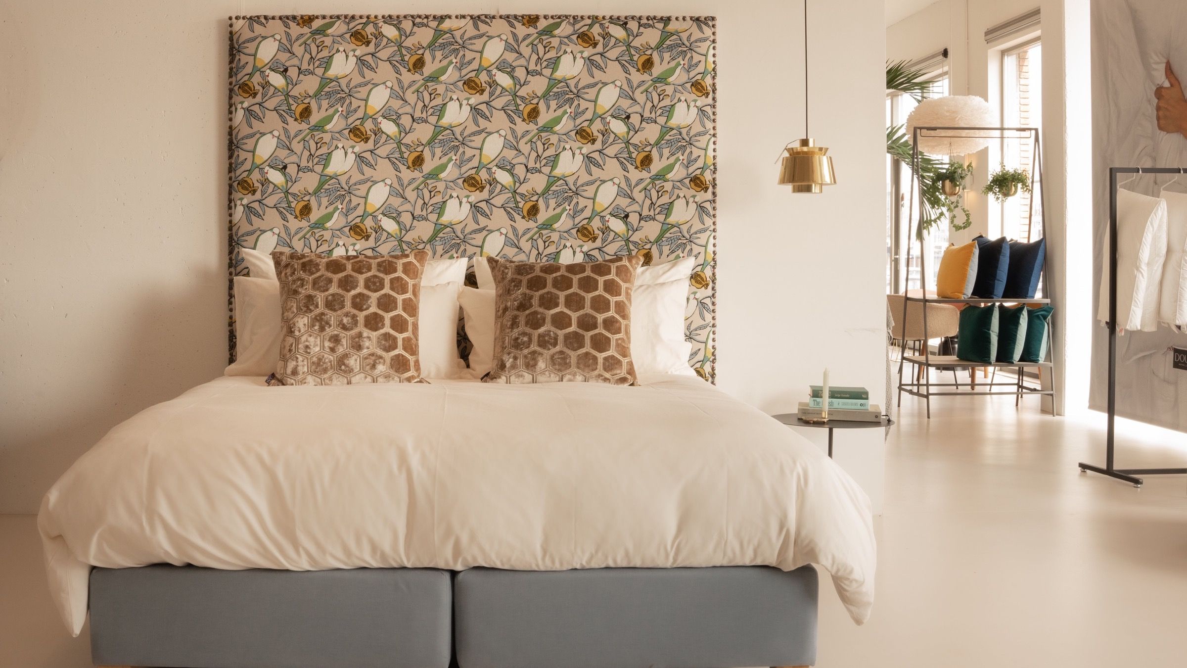 A DOUXE hotel-style boxspring bed styled in the brand's own concept store