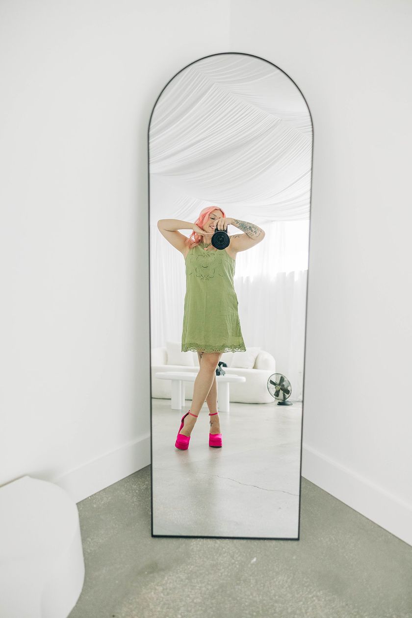 Sydney taking a mirror photo inside SMP Creative Studio
