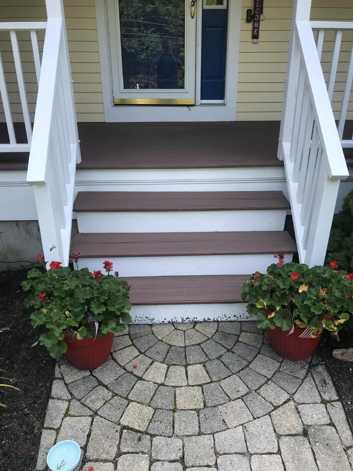 Stained front entry steps with clean white risers painted by Brookstone Painting and Carpentry in Plymouth County and Cape Cod