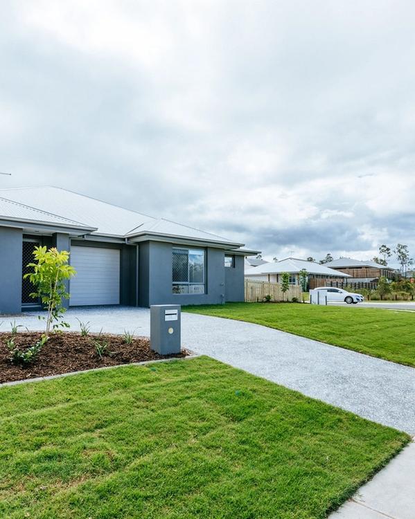 Image - Completed duplex pair, brick and timber