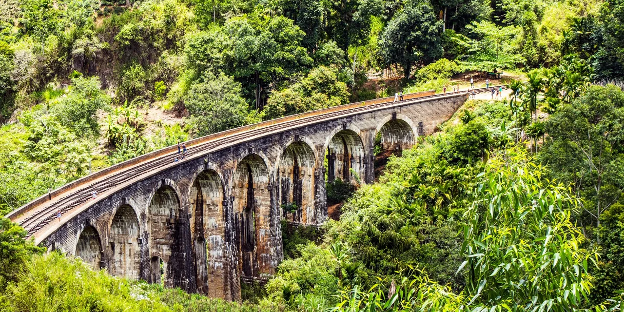 The Nine Arch Bridge curving through lush jungle hills near Ella, Sri Lanka