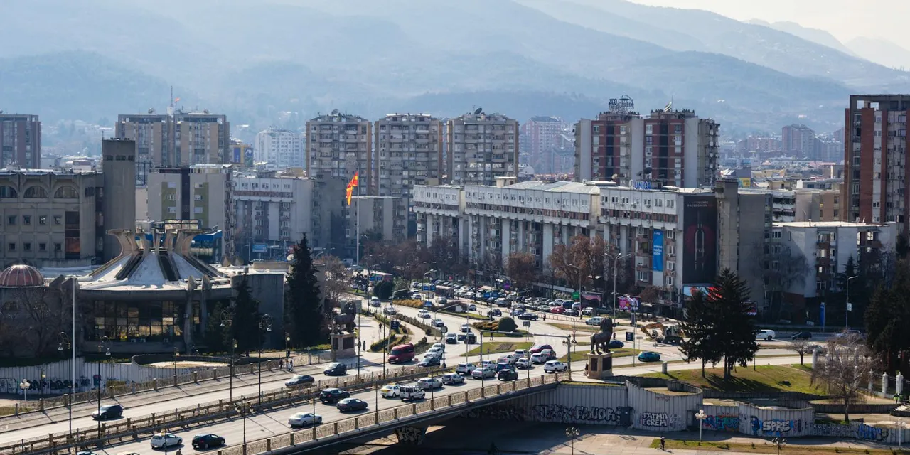 A bustling day in Skopje, North Macedonia, featuring urban architecture and scenic landscape.