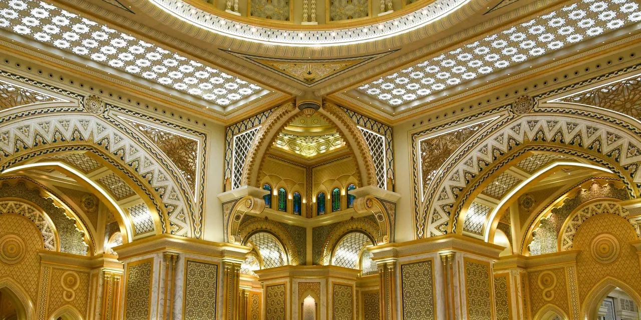Stunning ornate interior of a palace in Abu Dhabi, showcasing intricate Islamic architecture.