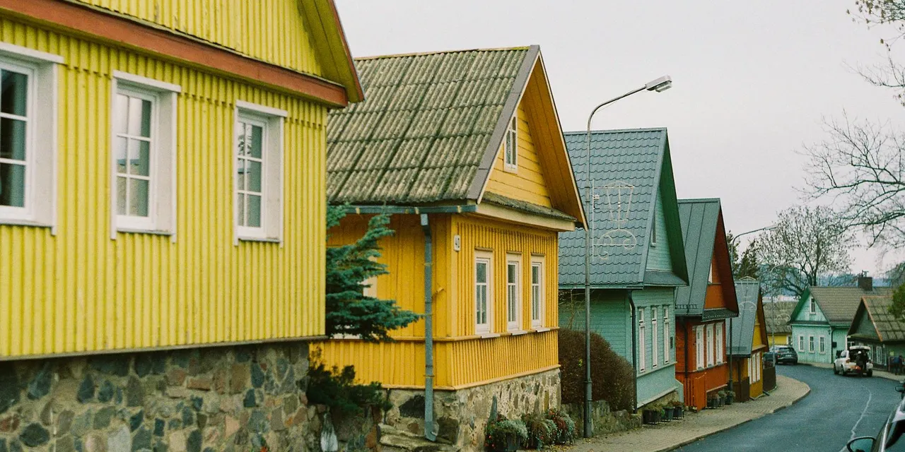 Charming street view of colorful wooden houses in Trakai, Lithuania.