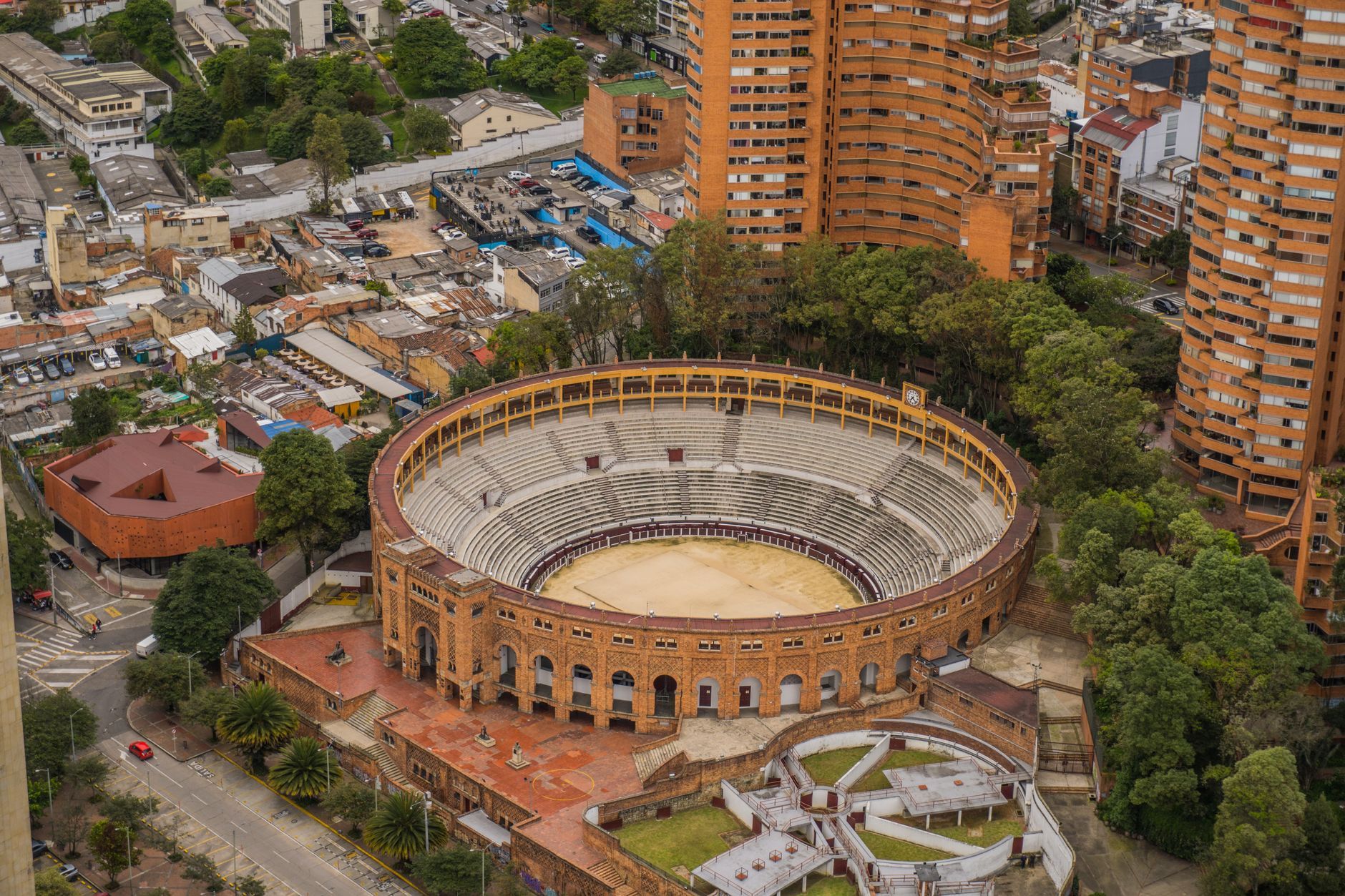 Drone view of the iconic Santamaria Bullring surrounded by urban Bogotá, Colombia.