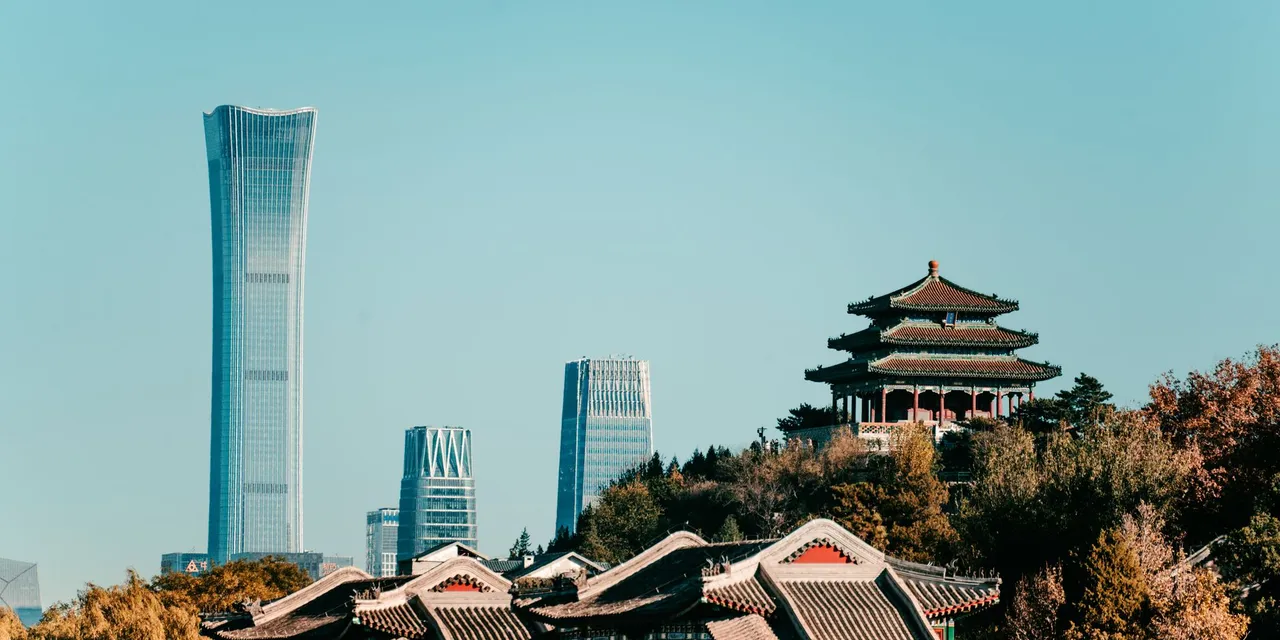 Captivating view of Beijing's skyline featuring traditional architecture and the modern China Zun skyscraper.