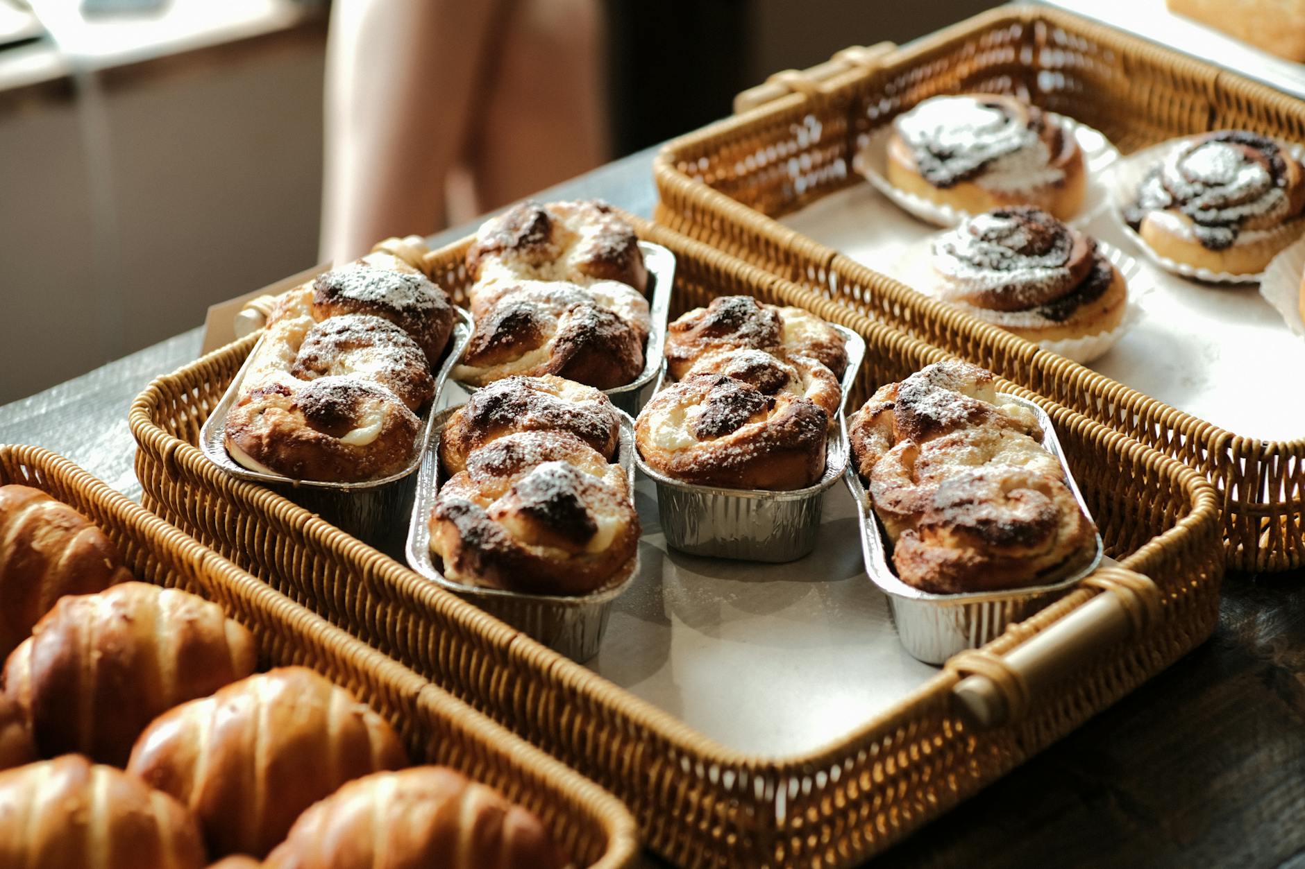 Freshly baked rolls and cakes in Spanish bakery