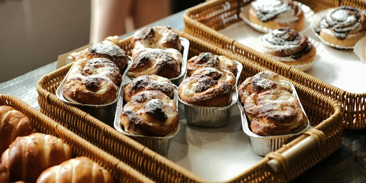 Freshly baked rolls and cakes in Spanish bakery